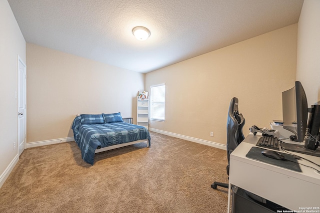 bedroom with light colored carpet, a textured ceiling, and baseboards