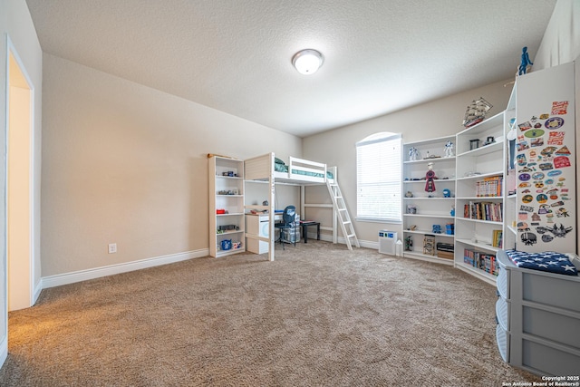 bedroom featuring baseboards, a textured ceiling, and carpet
