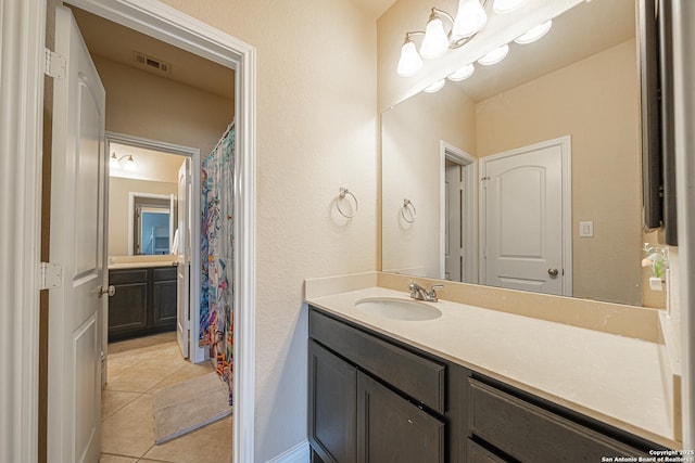 full bath featuring visible vents, tile patterned flooring, and vanity