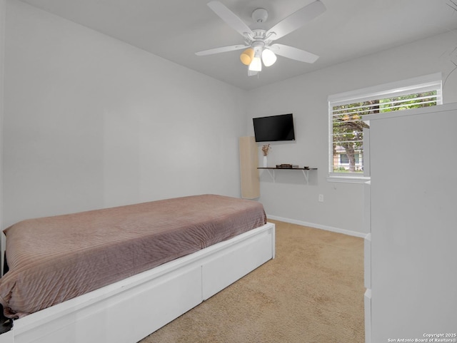 bedroom featuring baseboards, carpet flooring, and a ceiling fan