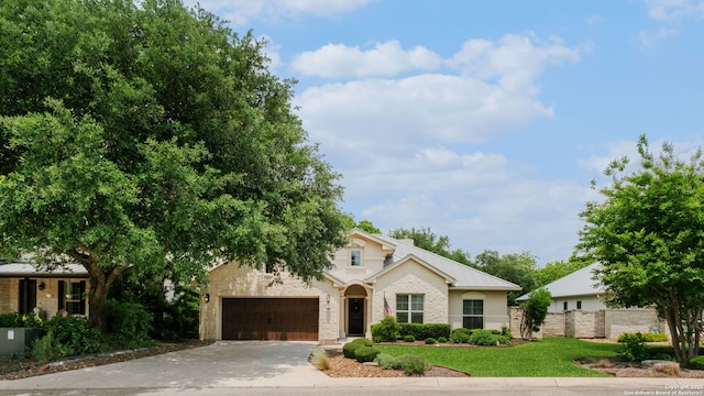 300 Knoll Spgs, Boerne, TX 78006 - view of front of home with an attached garage, fence, driveway, and a front yard