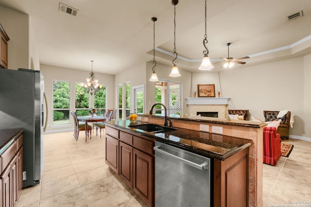 300 Knoll Spgs, Boerne, TX 78006 - kitchen featuring visible vents, ceiling fan with notable chandelier, a sink, appliances with stainless steel finishes, and a wealth of natural light