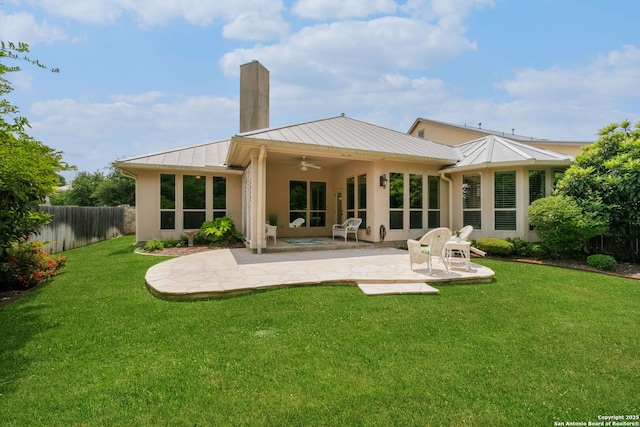 300 Knoll Spgs, Boerne, TX 78006 - back of property featuring fence, ceiling fan, a standing seam roof, a patio, and metal roof