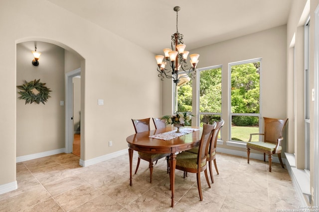 300 Knoll Spgs, Boerne, TX 78006 - dining area featuring arched walkways, baseboards, and a notable chandelier
