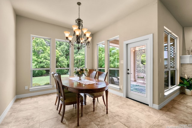 300 Knoll Spgs, Boerne, TX 78006 - dining room with baseboards, a wealth of natural light, and a chandelier