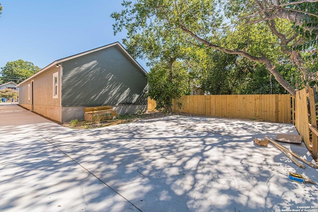 view of property exterior with fence