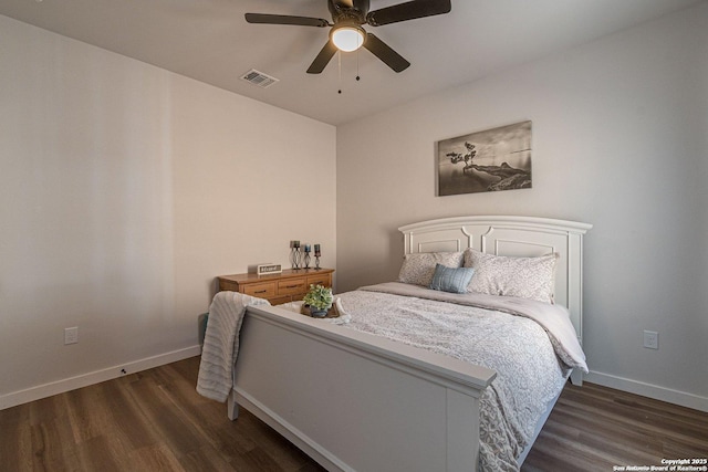 bedroom with ceiling fan, baseboards, visible vents, and wood finished floors