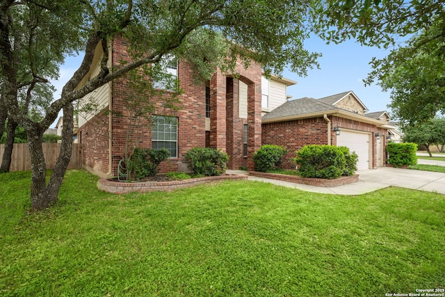 traditional home featuring fence, a front lawn, brick siding, a garage, and driveway