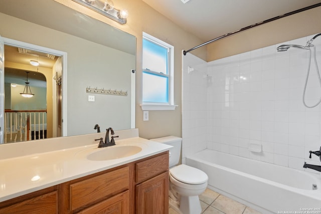 bathroom with tile patterned floors, vanity, toilet, and tub / shower combination