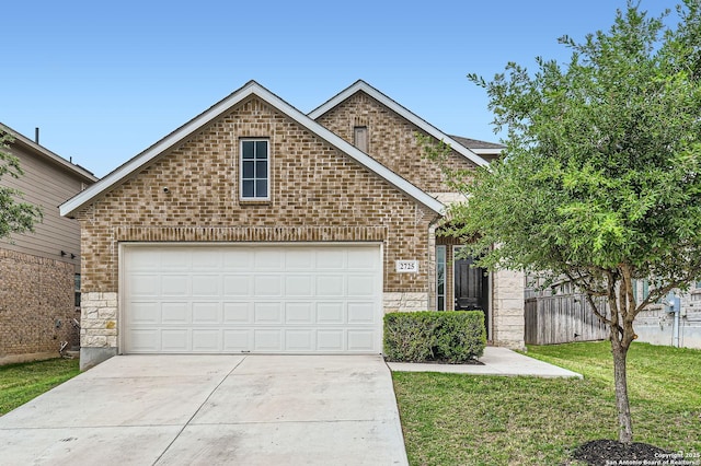 view of front facade featuring concrete driveway, brick siding, a front yard, and stone siding