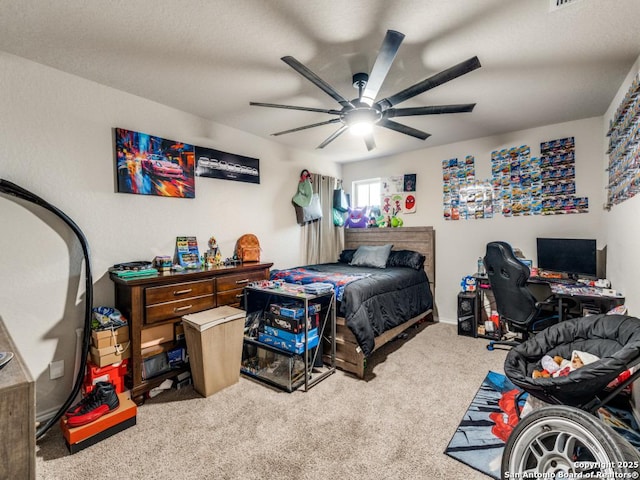 carpeted bedroom with a ceiling fan