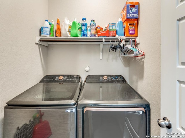 laundry area featuring laundry area and washing machine and clothes dryer