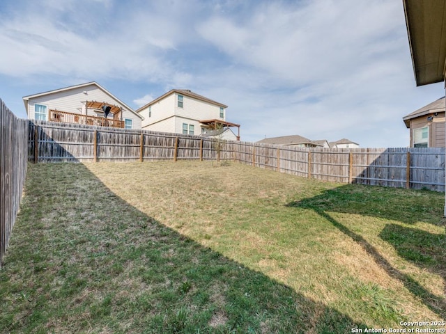 view of yard with a fenced backyard