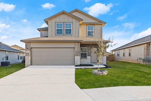 traditional-style home with board and batten siding, central air condition unit, a front lawn, concrete driveway, and an attached garage