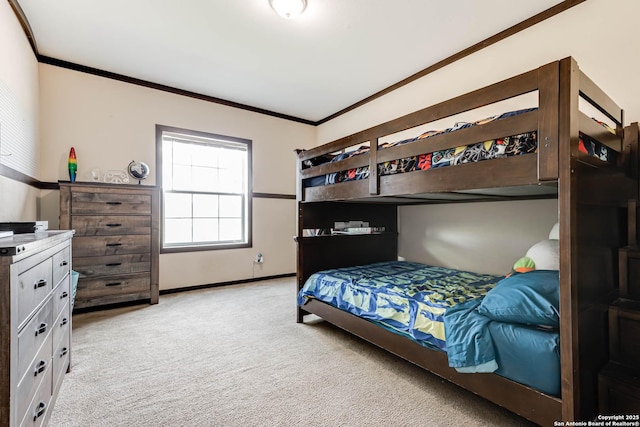 bedroom with baseboards, light colored carpet, and ornamental molding