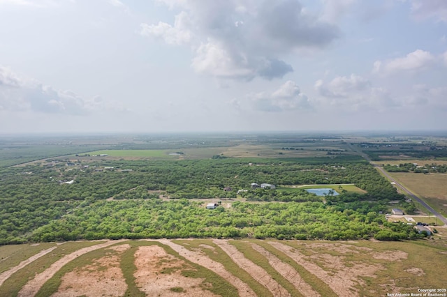drone / aerial view with a water view and a rural view