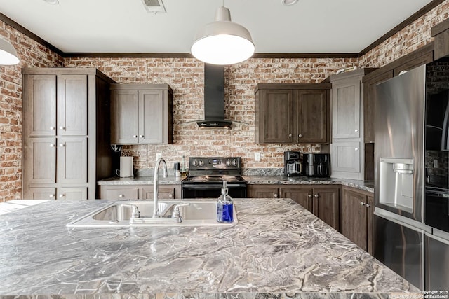 kitchen featuring crown molding, black electric range oven, wall chimney exhaust hood, a sink, and refrigerator with ice dispenser
