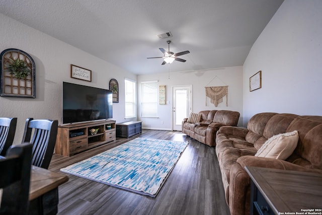 living room with a ceiling fan, wood finished floors, and visible vents