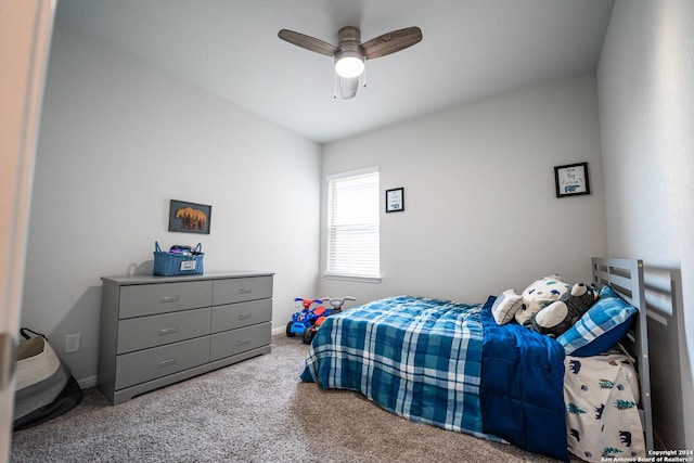 bedroom with carpet flooring, a ceiling fan, and baseboards
