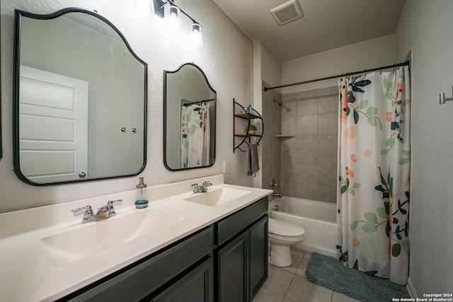 bathroom featuring a sink, tile patterned floors, shower / bath combo, and visible vents