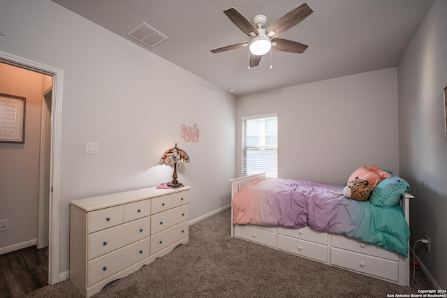 bedroom with baseboards, carpet, a ceiling fan, and visible vents