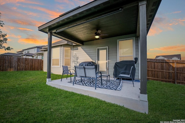 view of patio featuring a ceiling fan, a fenced backyard, and a grill
