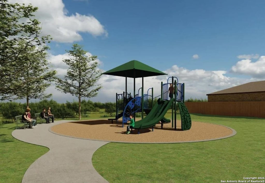 community jungle gym with a lawn and fence
