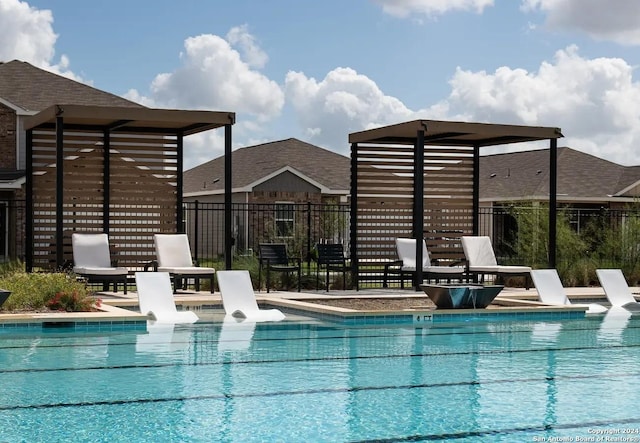 pool featuring fence