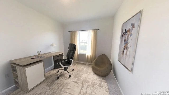 carpeted office space with baseboards