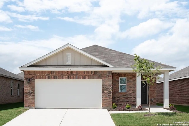 ranch-style house with brick siding, an attached garage, board and batten siding, and concrete driveway