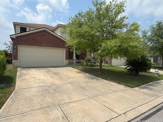 view of front of property featuring a garage, concrete driveway, a front lawn, and brick siding