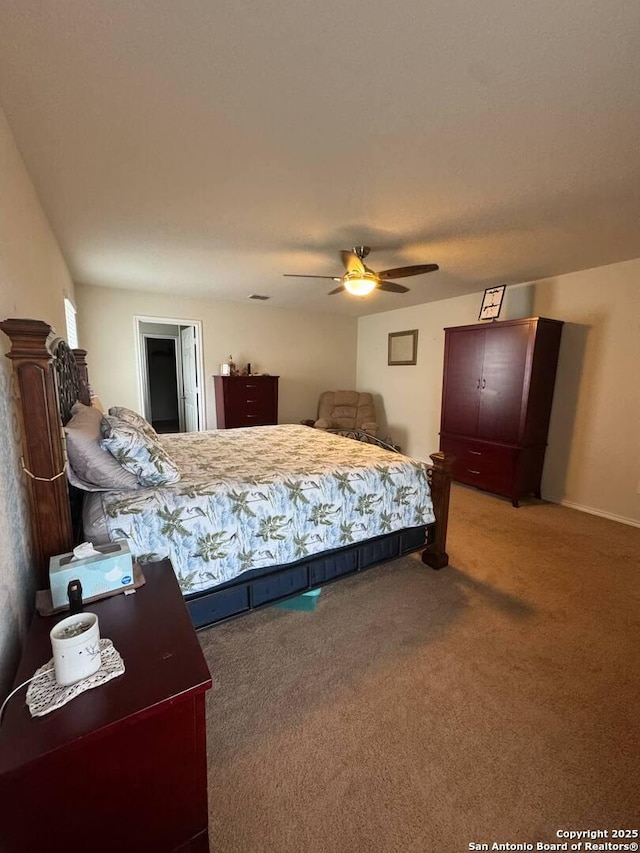 carpeted bedroom with a ceiling fan