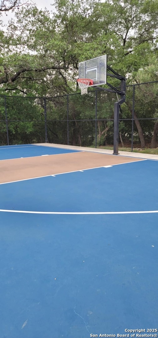 12518 Crockett Way, San Antonio, TX 78253 - view of sport court with fence and basketball court