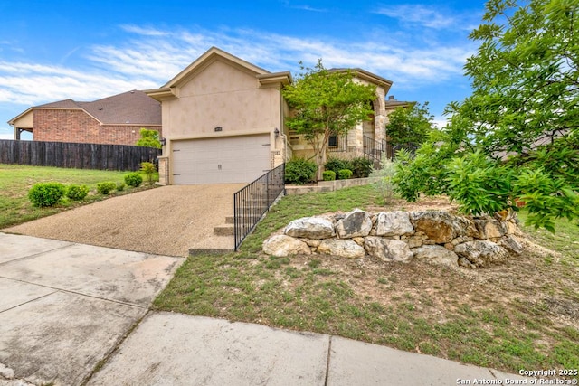 18718 Real Rdg, San Antonio, TX 78256 - view of front of house featuring driveway, a garage, fence, a front lawn, and stucco siding