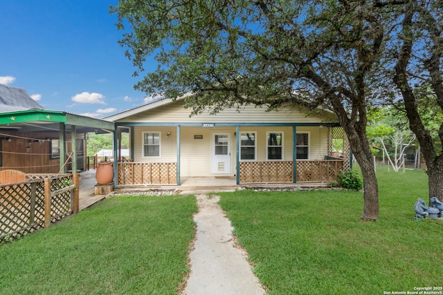 bungalow-style house featuring a porch and a front yard