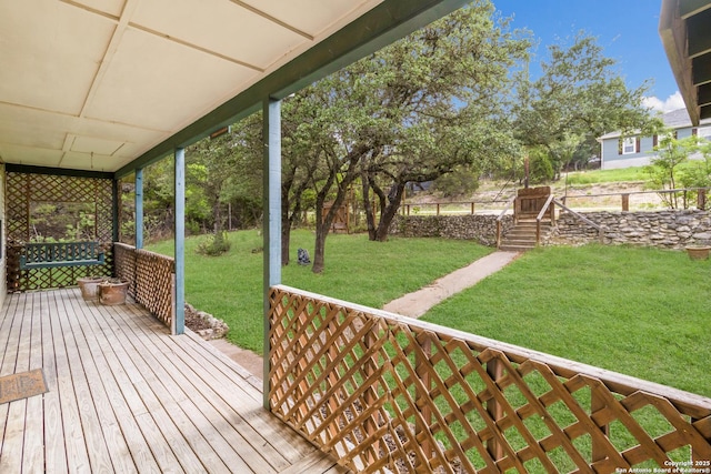 wooden deck with a yard