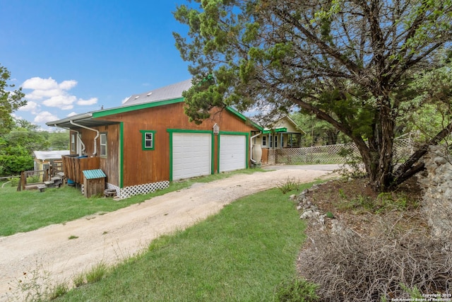 exterior space featuring fence and dirt driveway
