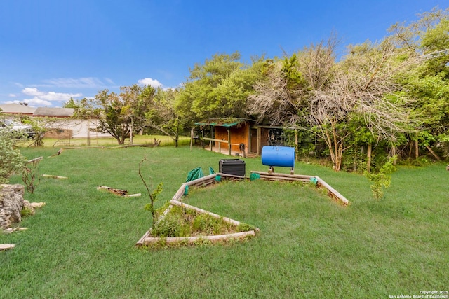 view of jungle gym featuring a lawn and central air condition unit