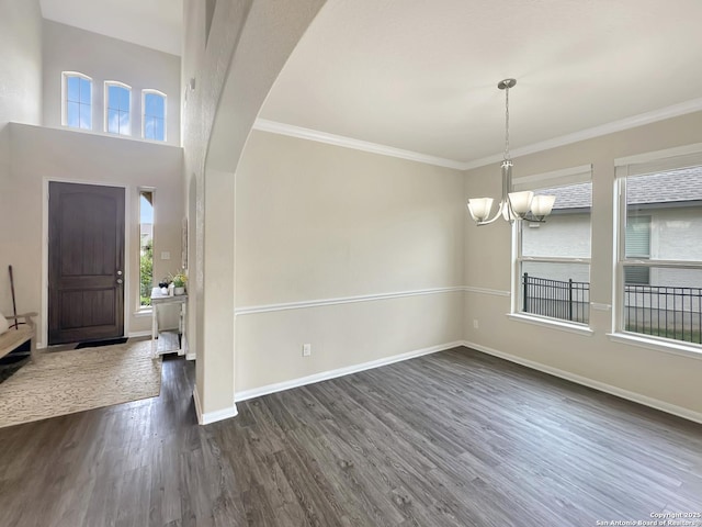 104 Talavera, Boerne, TX 78006 - entryway with dark wood-style flooring, a chandelier, baseboards, and ornamental molding