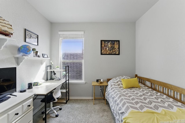 carpeted bedroom with baseboards