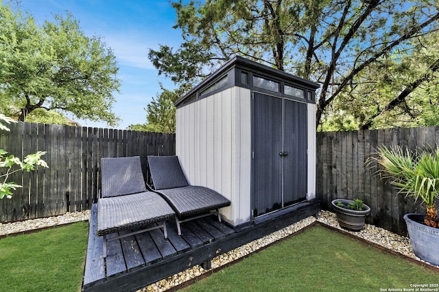 view of shed with a fenced backyard