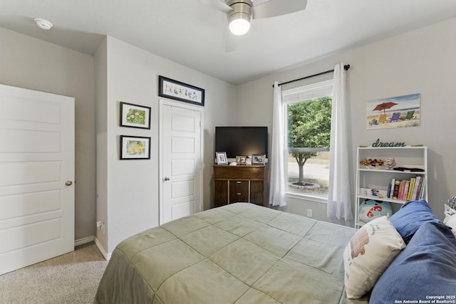 bedroom with baseboards, ceiling fan, and carpet