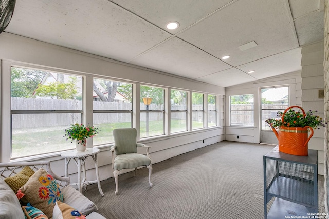 sunroom / solarium featuring carpet, vaulted ceiling, recessed lighting, and a wealth of natural light