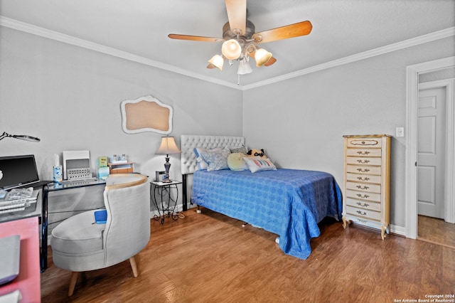 6377 County Road 659, Brazoria, TX 77422 - bedroom featuring baseboards, ornamental molding, a ceiling fan, and wood finished floors