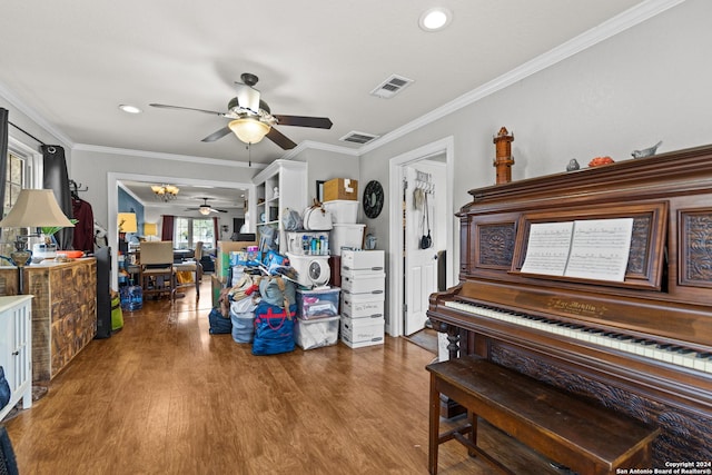 6377 County Road 659, Brazoria, TX 77422 - living area with crown molding, a ceiling fan, wood finished floors, and visible vents
