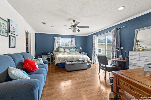 6377 County Road 659, Brazoria, TX 77422 - bedroom with ornamental molding and a textured ceiling