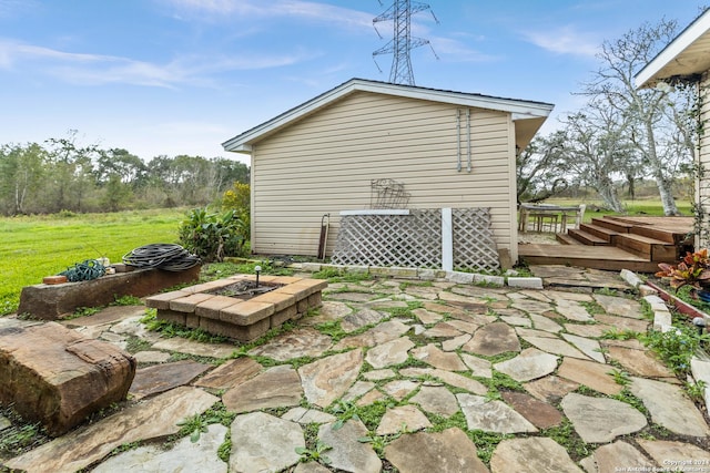 6377 County Road 659, Brazoria, TX 77422 - view of patio featuring a fire pit and a wooden deck
