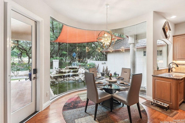 dining room featuring an inviting chandelier and light wood finished floors