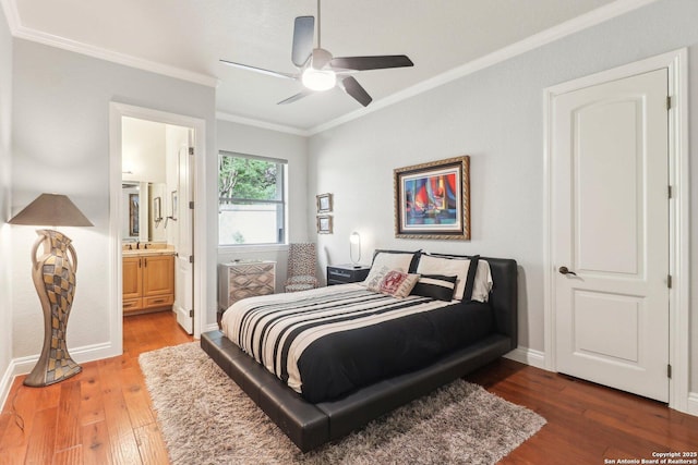 bedroom featuring ceiling fan, hardwood / wood-style flooring, baseboards, connected bathroom, and ornamental molding