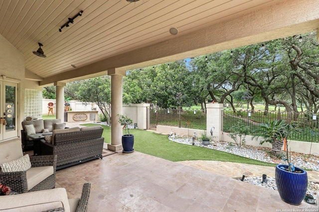 view of patio featuring a fenced backyard and outdoor lounge area